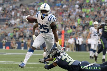 Aug 9, 2018; Seattle, WA, USA; Indianapolis Colts running back Marlon Mack (25) is defended by Seattle Seahawks defensive back Bradley McDougald (30) in the first quarter during a preseason game at CenturyLink Field. Mandatory Credit: Kirby Lee-USA TODAY Sports