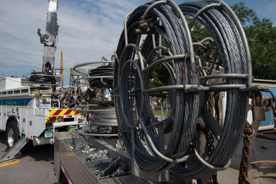 Florida Power & Light displays some of the company's equipment to restore power during an outage or other energy-related emergency on May 12. FPL on Monday backed away from a controversial proposal that would have used a severe winter storm in 1989 as a basis for future power plant projects.