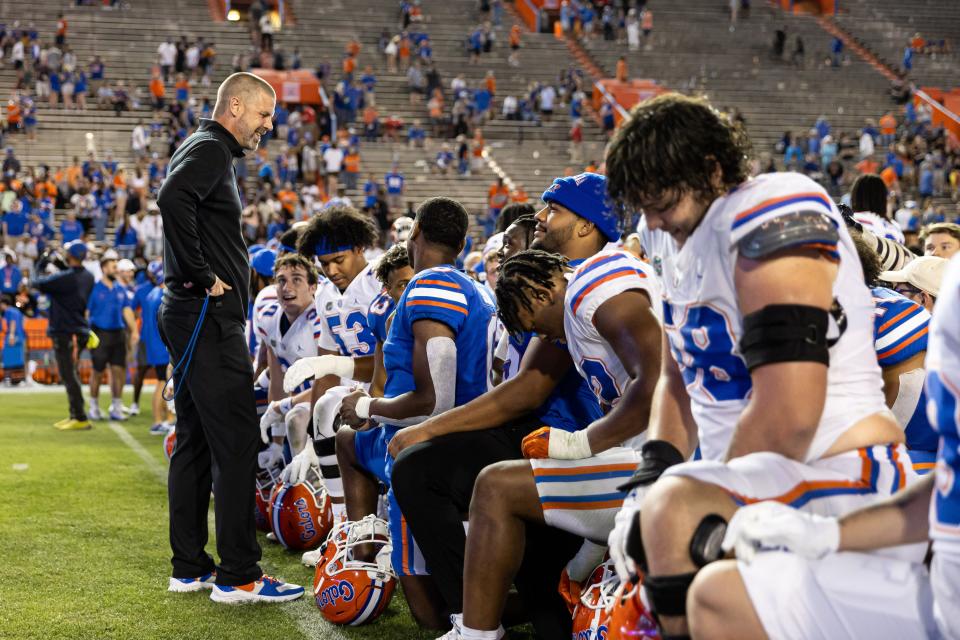 Florida Gators head coach Billy Napier jokes with players after the game during the Florida Gators Orange and Blue Spring Game at Steve Spurrier Field at Ben Hill Griffin Stadium in Gainesville, Florida, on Thursday, April 13, 2023. Matt Pendleton/Gainesville Sun