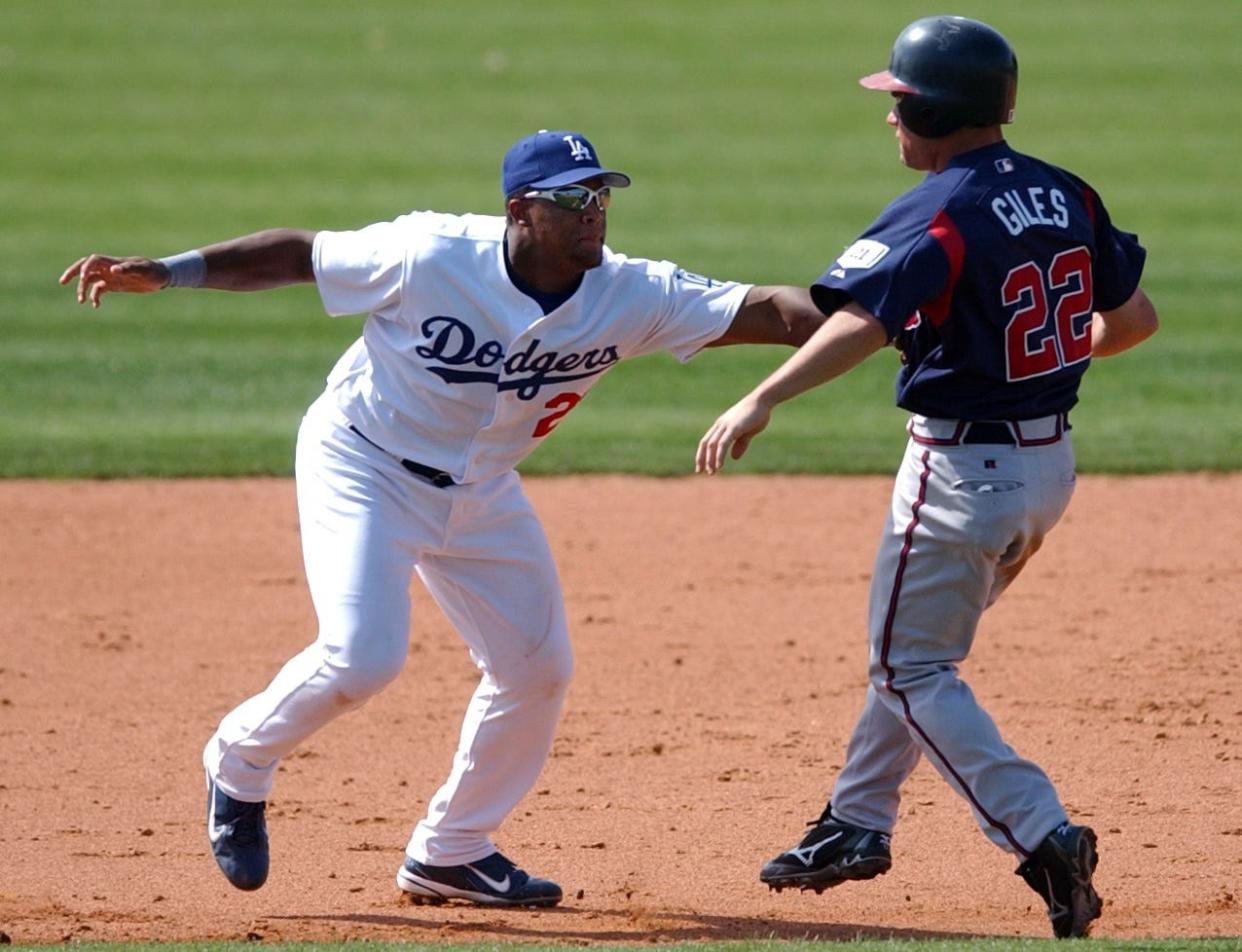 Adrian Beltre, Los Angeles Dodgers third baseman, tags Marcus Giles of the Atlanta Braves during a spring training game at Holman Stadium in Vero Beach March 5, 2004. The Dodgers won 6-5.