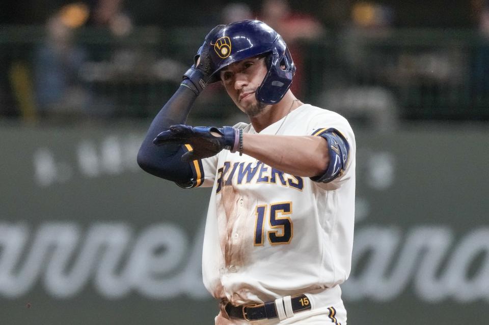 Milwaukee Brewers' Tyrone Taylor reacts after hitting an RBI double during the seventh inning of a baseball game against the St. Louis Cardinals Wednesday, Sept. 27, 2023, in Milwaukee. (AP Photo/Morry Gash)