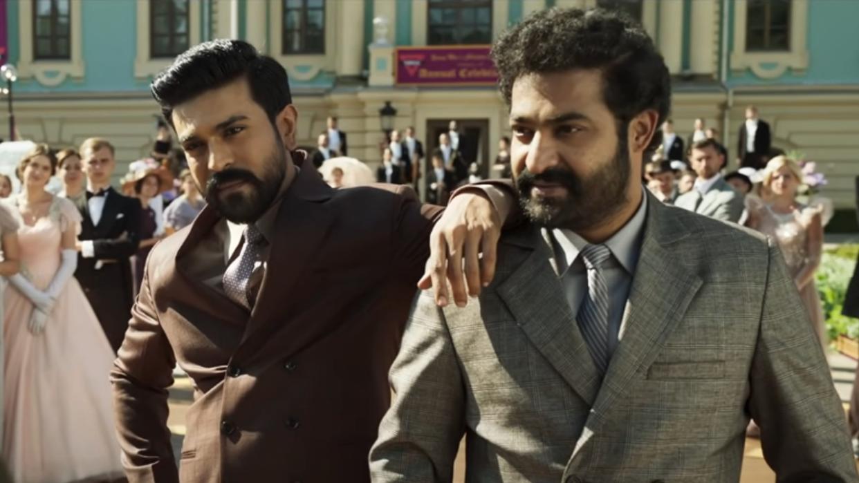  Ram Charan Teja leaning is arm on N.T. Rama Rao Jr.'s shoulder in RRR 