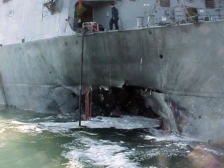 The port side damage to the guided missile destroyer USS Cole is pictured after a bomb attack during a refueling operation in the port of Aden in this October 12, 2000 file photo. REUTERS/Aladin Abdel Naby/Files