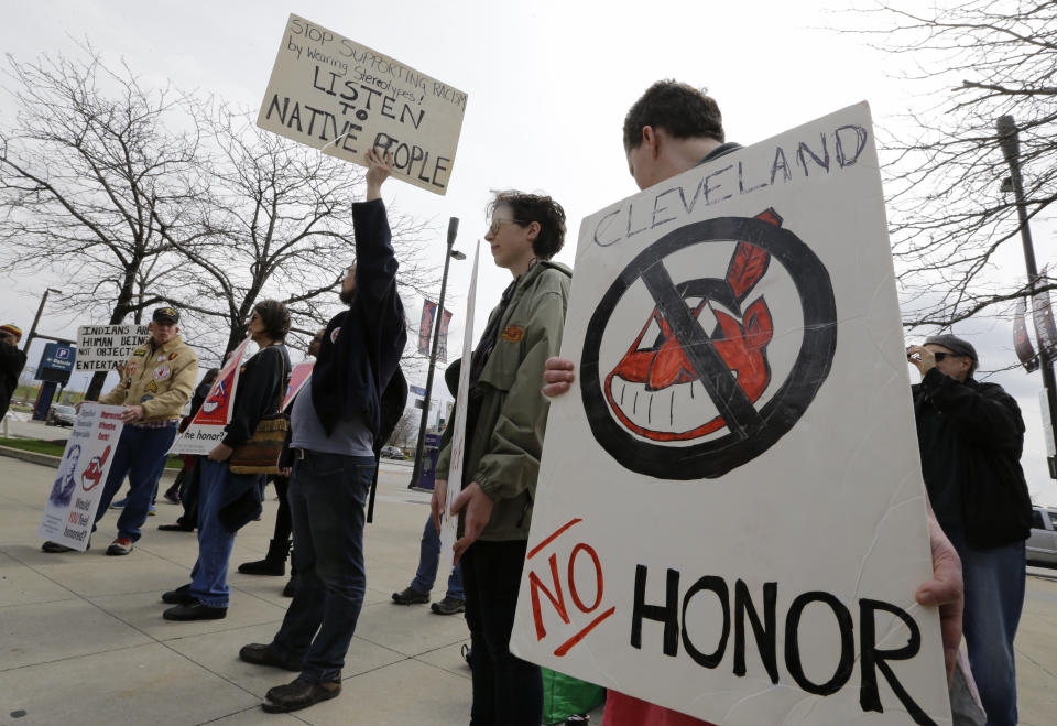 People protest before a baseball game between the Chicago White Sox and the Cleveland Indians, Tuesday, April 11, 2017, during opening day in Cleveland. (AP Photo/Tony Dejak)