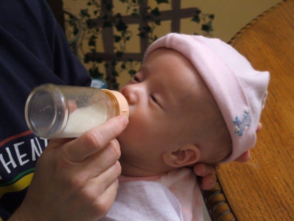 Trying to feed Zoe her first night at home. (Photo: Courtesy of Dina Zirlott)