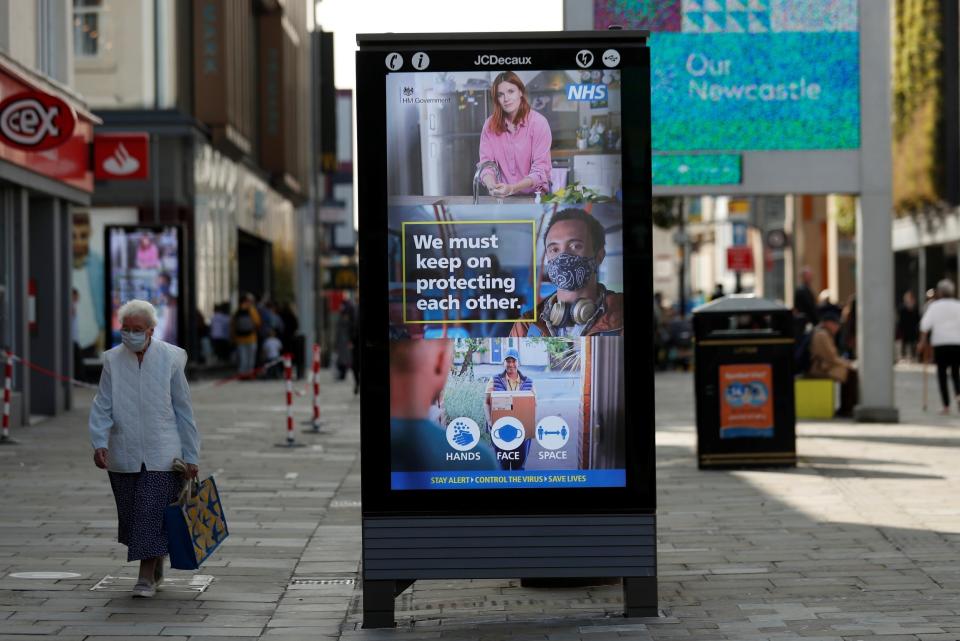 A sign of precautionary health and safety measures is seen on Northumberland Street in Newcastle (REUTERS)