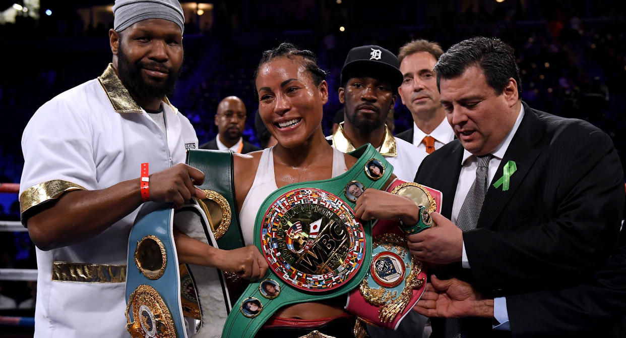 Cecilia Braekhus poses with her belts after defeating Kali Reis in a unanimous decision at StubHub Center on Saturday in Carson, California. (Getty Images)