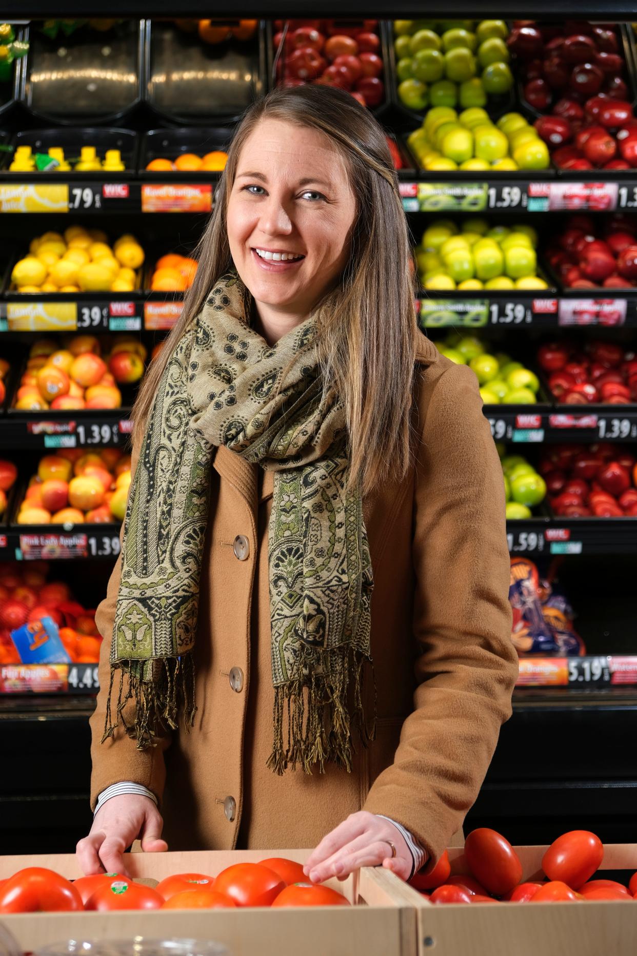 Oklahoma Woman of the Year Caylee Dodson, executive director of RestoreOKC, stands near the produce section at the Market at EastPoint, a community grocery store that RestoreOKC helped bring to reality in 2021 in northeast Oklahoma City.