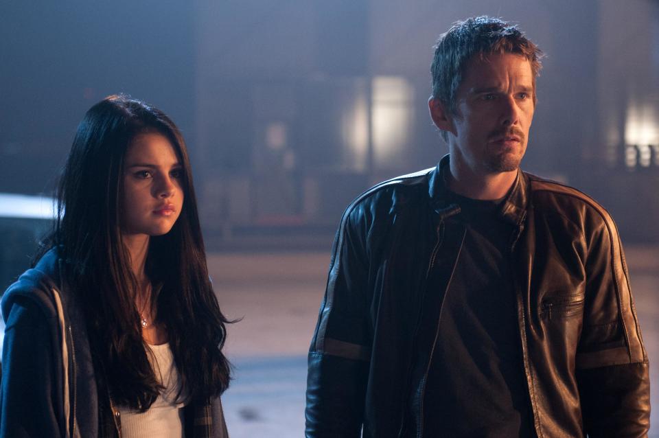 This film image released by Warner Bros. Pictures shows Selena Gomez, left, and Ethan Hawke in a scene from "Getaway." (AP Photo/Warner Bros. Pictures, Simon Varsano)