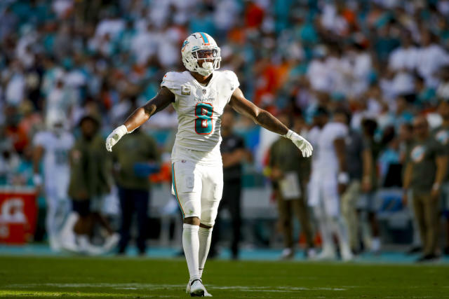 Miami Dolphins defensive back Jevon Holland flies through the gap untouched  for a third-down tackle for a loss