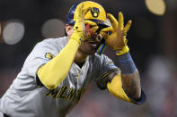 Milwaukee Brewers' Joey Ortiz gestures at third base after he tripled against the Baltimore Orioles during the second inning of a baseball game Friday, April 12, 2024, in Baltimore. (AP Photo/Nick Wass)