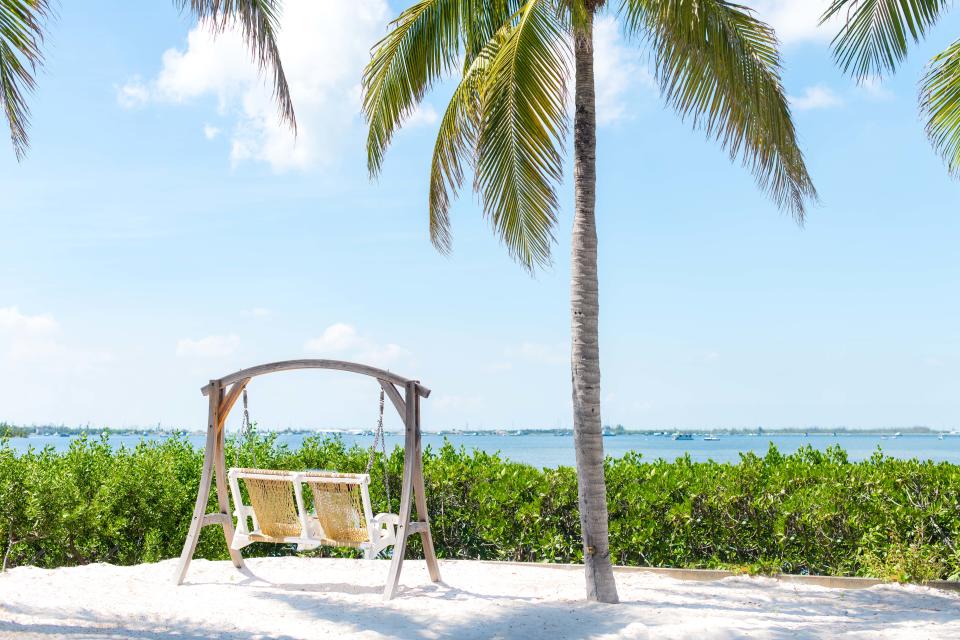 Two chairs with water views at Parrot Key Hotel & Villas (Parrot Key Hotel & Villas)