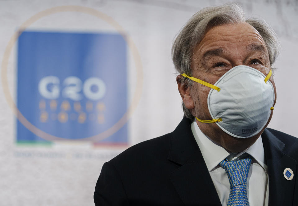 United Nations Secretary General Antonio Guterres wears a face mask at the end of a press conference in Rome, Friday, Oct. 29, 2021. Guterres blamed geo-political divides for hampering a global vaccination plan to reach "everyone, everywhere" to fight the COVID-19 pandemic. (AP Photo/Domenico Stinellis)