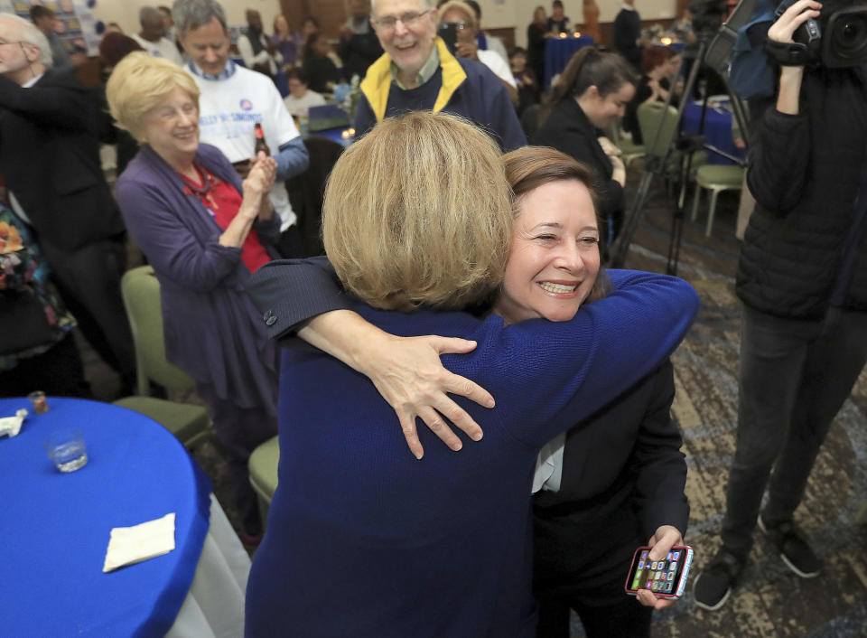 Candidate for the 94th District, Shelly Simonds, celebrates with supporters as election results begin to come in Tuesday, Nov. 5, 2019, at the Marriott in Newport News, Va. (Rob Ostermaier/The Virginian-Pilot via AP)