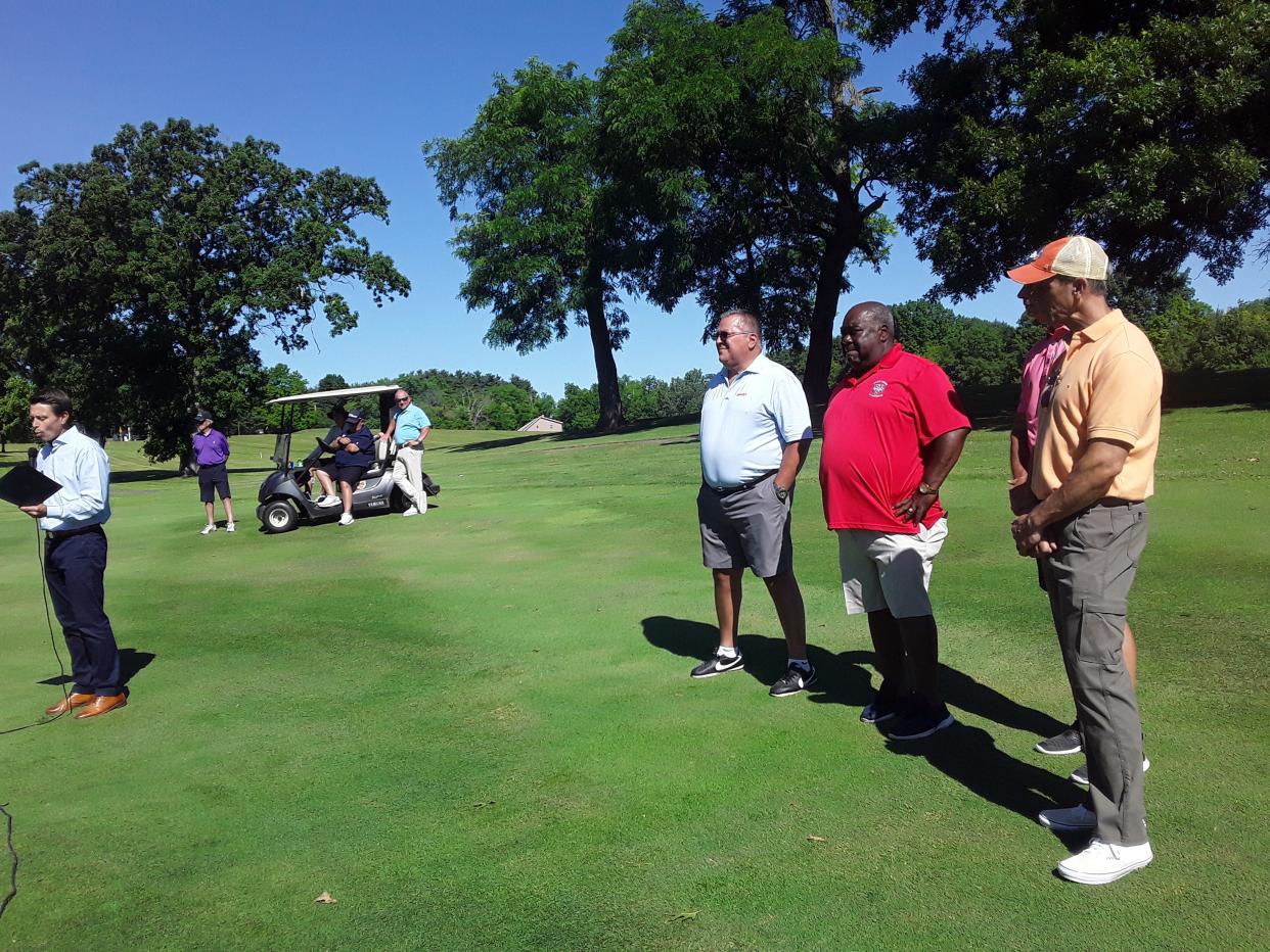 Warren Jones (red shirt) was honored with a proclamation by Ashland Mayor Matt Miller for his lifetime of community service before the start of the Wendy's Golf Classic on Friday at the Ashland Golf Club.