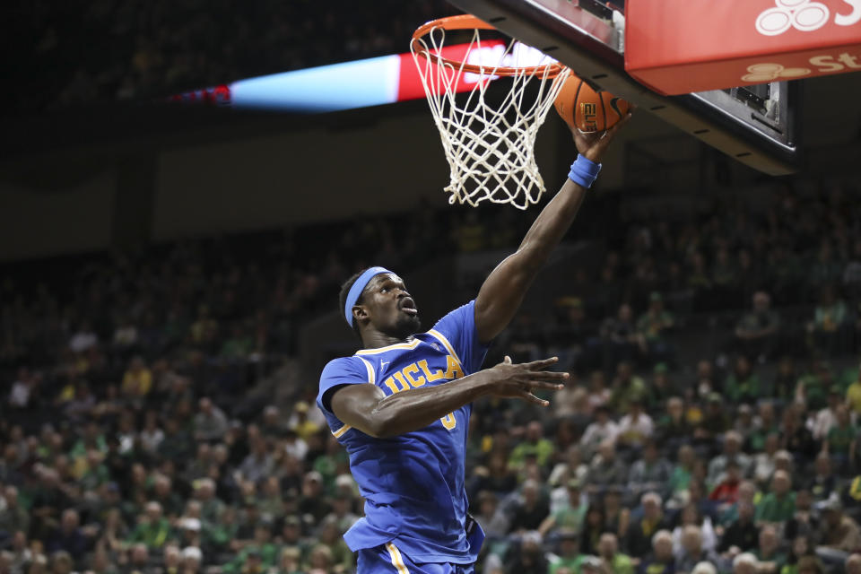 UCLA forward Adem Bona drives to the basket against Oregon during the second half of an NCAA college basketball game in Eugene, Ore., Saturday, Dec. 30, 2023. (AP Photo/Amanda Loman)