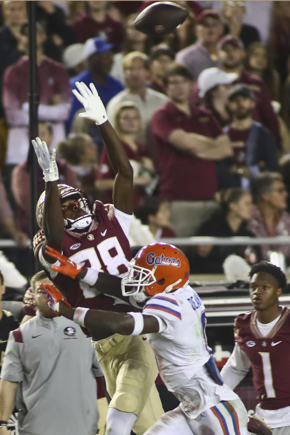 Florida State wide receiver Kentron Poitier (88) cannot catch a pass as Florida safety Trey Dean III (0) defends in the second quarter of an NCAA college football game Friday, Nov. 25, 2022, in Tallahassee, Fla. (AP Photo/Phil Sears)