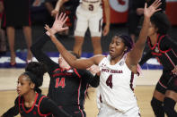 South Carolina forward Aliyah Boston (4) fouls Georgia center Jenna Staiti (14) during the first half of an NCAA college basketball game Sunday, March 7, 2021, during the Southeastern Conference tournament final in Greenville, S.C. (AP Photo/Sean Rayford)