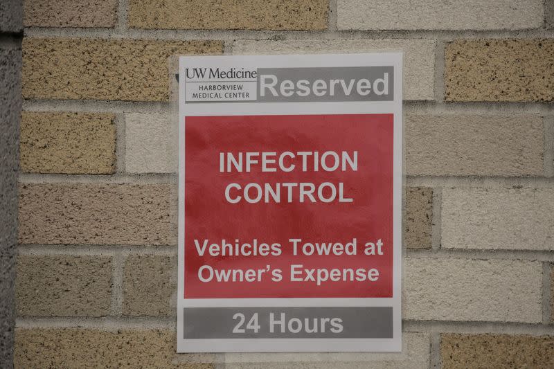 A parking sign for the vehicle of Harborview Medical Center's home assessment team, which screens patients at their homes who may have been exposed to novel coronavirus, is seen at Harborview Medical Center in Seattle