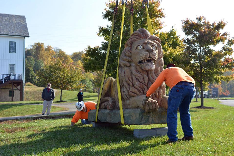 Crews set the 10,000-pound donated lion atop blocks at Beckett Park in West Chester Township.