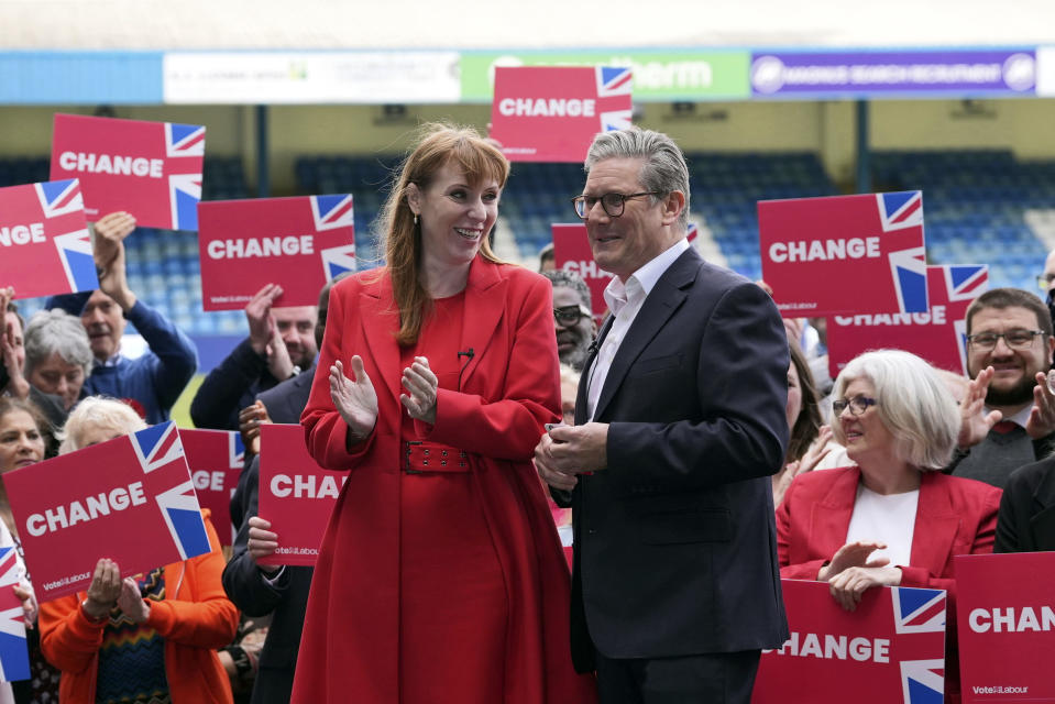 Britain's Labour Party leader Keir Starmer, right, during a visit to Gillingham Football club in Gillingham, Kent, England, Thursday May 23, 2024, while on the General Election campaign trail. Britain’s political party leaders were crisscrossing the country on Thursday, the first day of a six-week election campaign in which voters will decide whether to end the governing Conservatives’ 14 years in power. (Gareth Fuller/PA via AP)