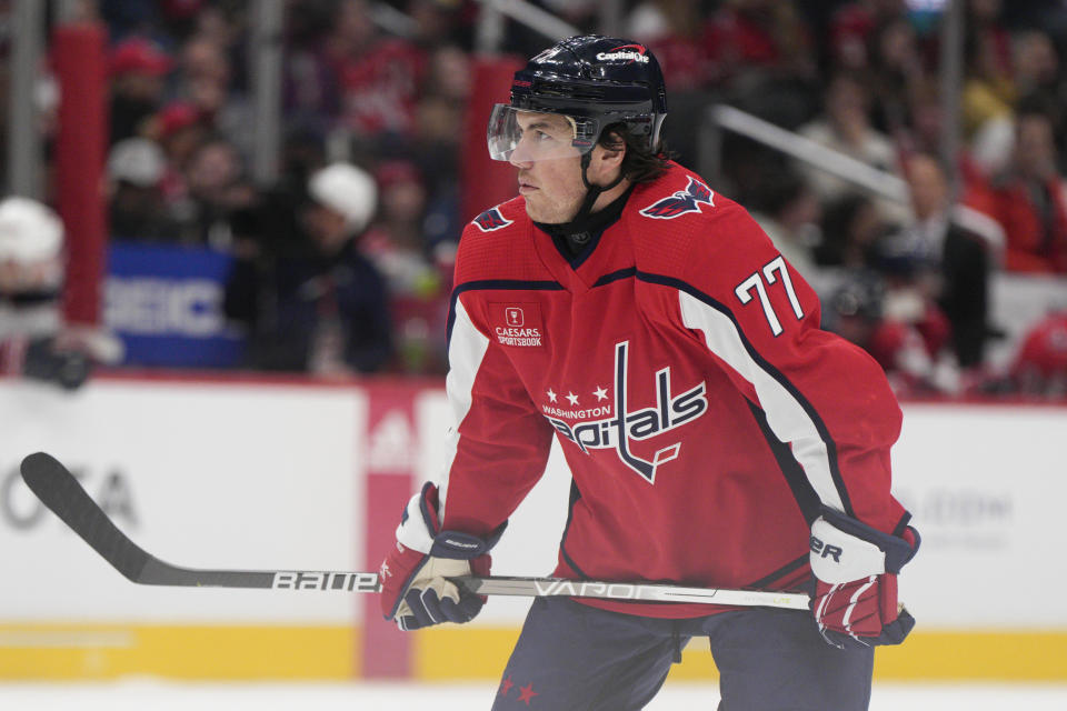 Washington Capitals right wing T.J. Oshie wears a neck guard as he skates against the Columbus Blue Jackets during the second period of an NHL hockey game Saturday, Nov. 4, 2023, in Washington. (AP Photo/Jess Rapfogel)