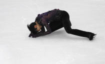 Japan's Yuzuru Hanyu competes in the men's free skating during the figure skating Grand Prix finals at the Palavela ice arena, in Turin, Italy, Saturday, Dec. 7, 2019. (AP Photo/Antonio Calanni)