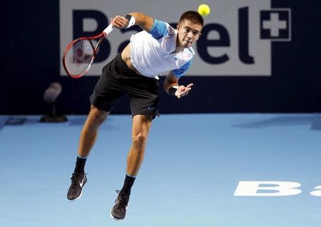 Croatia's Borna Coric serves the ball to Kevin Anderson of South Africa during their match at the Swiss Indoors ATP men's tennis tournament in Basel, Switzerland, October 28, 2015. REUTERS/Arnd Wiegmann