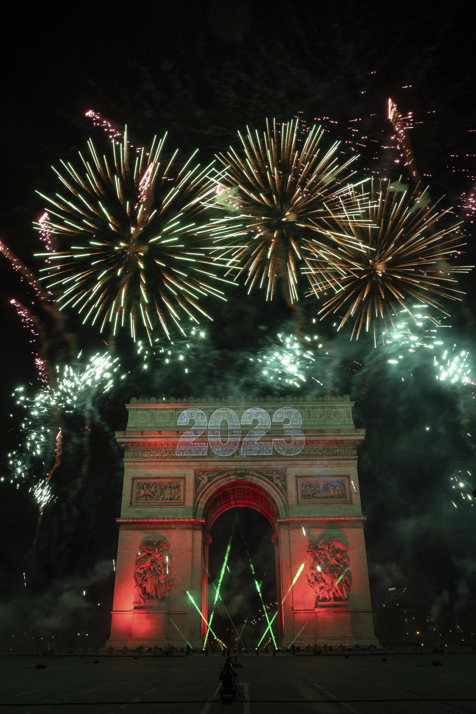 A sound and light show is projected on the Arc de Triomphe during New Year celebrations on the Champs Elysees in Paris, France, Sunday, Jan. 1, 2023. (AP Photo/Aurelien Morissard)