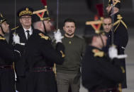 Ukrainian President Volodymyr Zelenskyy, center, andFrench Defense Minister Sebastien Lecornu, right, walk on the tarmac of the Orly airport, south of Paris, Wednesday, Feb. 8, 2023. Ukrainian President Volodymyr Zelenskyy will later have a working diner with French President Emmanuel Macron and German Chancellor Olaf Scholz at the Elysee Palace (Julien de Rosa, pool via AP)