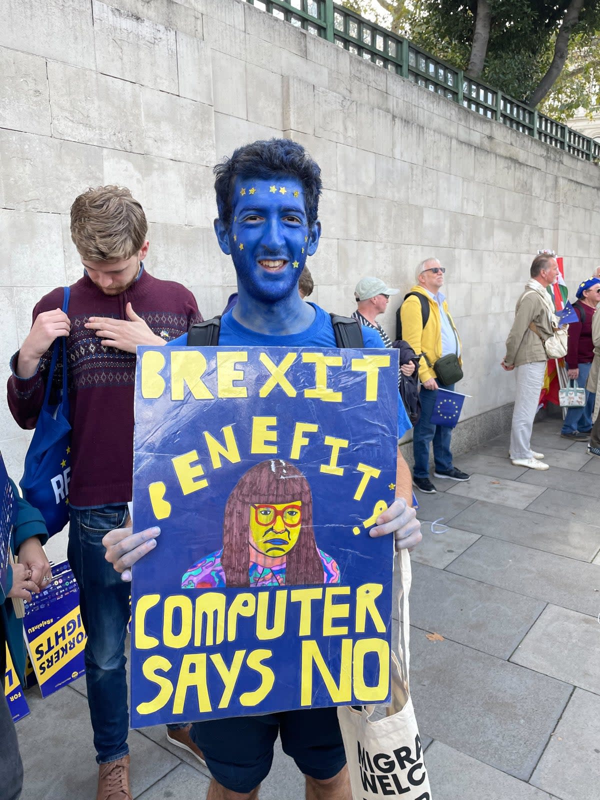 Eric Stoch, 23, north London, was painted head to toe in blue body paint for the march (Barney Davis)