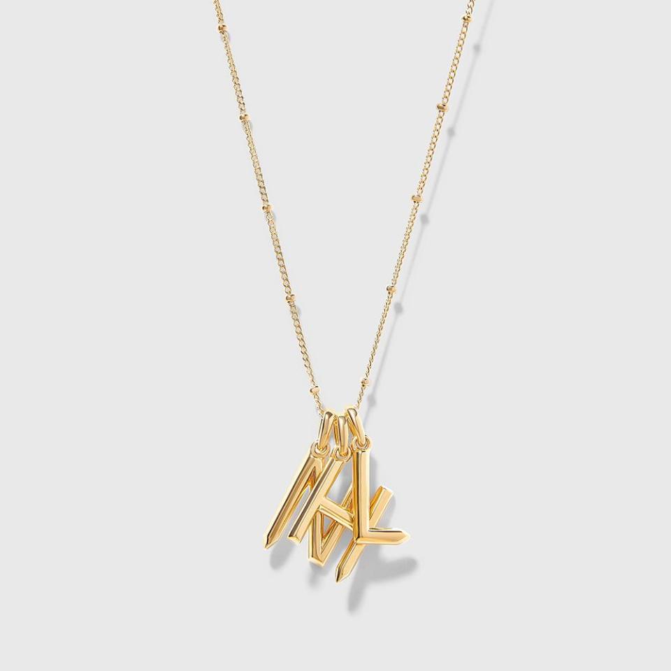 <p><a href="https://go.redirectingat.com?id=74968X1596630&url=https%3A%2F%2Fedgeofember.com%2Fproducts%2Ftriple-initial-necklace-gold&sref=https%3A%2F%2F" rel="nofollow noopener" target="_blank" data-ylk="slk:Shop Now;elm:context_link;itc:0;sec:content-canvas" class="link ">Shop Now</a></p><p>Triple Initial Necklace - Gold</p><p>edgeofember.com</p><p>$240.00</p>