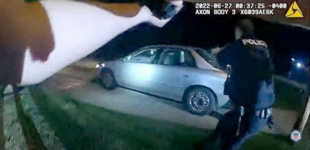 PHOTO: This image captured from a police officer's body camera and provided by the Akron Police Department on July 3, 2022, shows police surrounding the vehicle of 25 year old Jayland Walker during a traffic stop in Akron, Ohio, on June 27, 2022. (Akron Police Department/AFP via Getty Images)