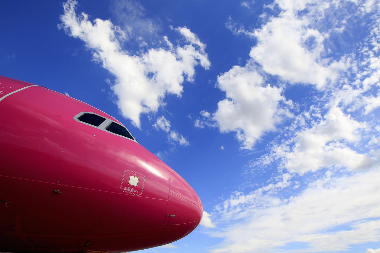 airline Wizz Air's aircraft is parked on the tarmac at Budapest Airport July 10, 2014. Wizz Air's maiden flight to London took off from Katowice in May 2004. It now has over 300 routes, annual revenues of 1 billion euros, counts Ryanair, another no-frills airline as its main competitor, and dominates air travel in a region with faster economic growth than the rest of Europe. Organic expansion in the region and as far afield as Moscow, Tel-Aviv or Dubai is set to continue while a new phase of growth is likely to come from Wizz Air exploiting the difficulties of state-backed regional airlines that are struggling to survive. To match story WIZZAIR-HUNGARY/   Picture taken July 10, 2014. REUTERS/Bernadett Szabo (HUNGARY - Tags: BUSINESS TRANSPORT)