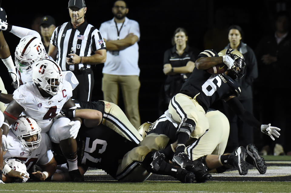 Vanderbilt running back Re'Mahn Davis (6) spins around as he runs for a touchdown against Stanford in the first half of an NCAA college football game Saturday, Sept. 18, 2021, in Nashville, Tenn. (AP Photo/Mark Zaleski)