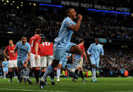 MANCHESTER, ENGLAND - APRIL 30: Vincent Kompany of Manchester City celebrates scoring the opening goal during the Barclays Premier League match between Manchester City and Manchester United at the Etihad Stadium on April 30, 2012 in Manchester, England. (Photo by Michael Regan/Getty Images)