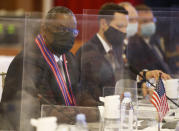 U.S. Defense Secretary Lloyd Austin, left, leads his delegation in a bilateral meeting with Philippines counterparts led by Defense Secretary Delfin Lorenzana at Camp Aguinaldo military camp in Quezon City, Metro Manila, Philippines Friday, July 30, 2021. Austin is visiting Manila to hold talks with Philippine officials to boost defense ties and possibly discuss the The Visiting Forces Agreement between the US and Philippines. (Rolex dela Pena/Pool Photo via AP)