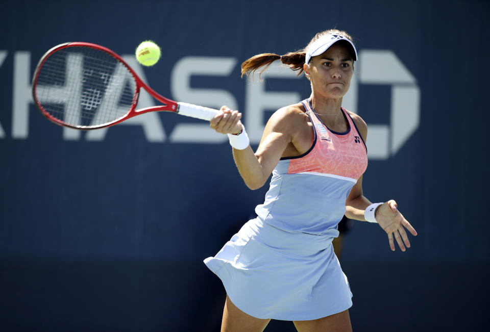 FILE - Monica Puig, of Puerto Rico, returns a shot to Rebecca Peterson, of Sweden, during the first round of the U.S. Open tennis tournament Monday, Aug. 26, 2019, in New York. Rio de Janeiro Olympics gold medalist Monica Puig announced her retirement from professional tennis at age 28 via a post on social media Monday, June 13, 2022. (AP Photo/Michael Owens), File