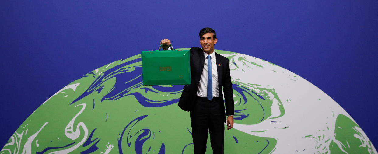 Britain's Chancellor of the Exchequer Rishi Sunak holds a green budget box during the UN Climate Change Conference (COP26) in Glasgow, Scotland. Photo: Reuters