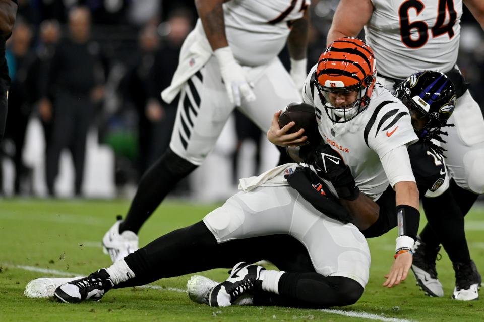 Nov 16, 2023; Baltimore, Maryland, USA; Baltimore Ravens linebacker Jadeveon Clowney (24) sacks Cincinnati Bengals quarterback Joe Burrow (9) during the first quarter at M&T Bank Stadium. Mandatory Credit: Tommy Gilligan-USA TODAY Sports