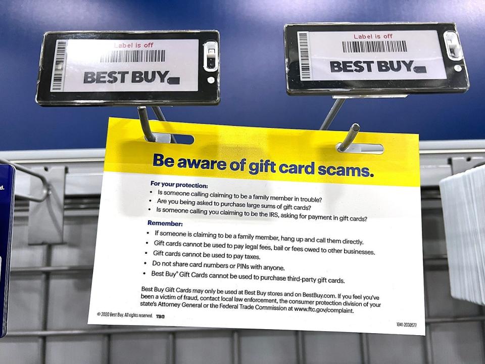 A sign warns buyers about gift card scams at Best Buy in Tacoma, Wash., on Aug. 31.