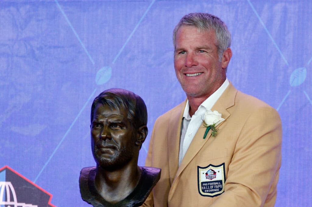 Brett Favre, former NFL quarterback, poses with his bronze bust during the NFL Hall of Fame Enshrinement Ceremony at the Tom Benson Hall of Fame Stadium on August 6, 2016 in Canton, Ohio. (Photo by Joe Robbins/Getty Images)