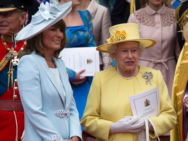 <p>Anwar Hussein/Getty</p> Carole Middleton and Queen Elizabeth ll at the Royal Wedding of Prince William to Catherine Middleton in 2011.