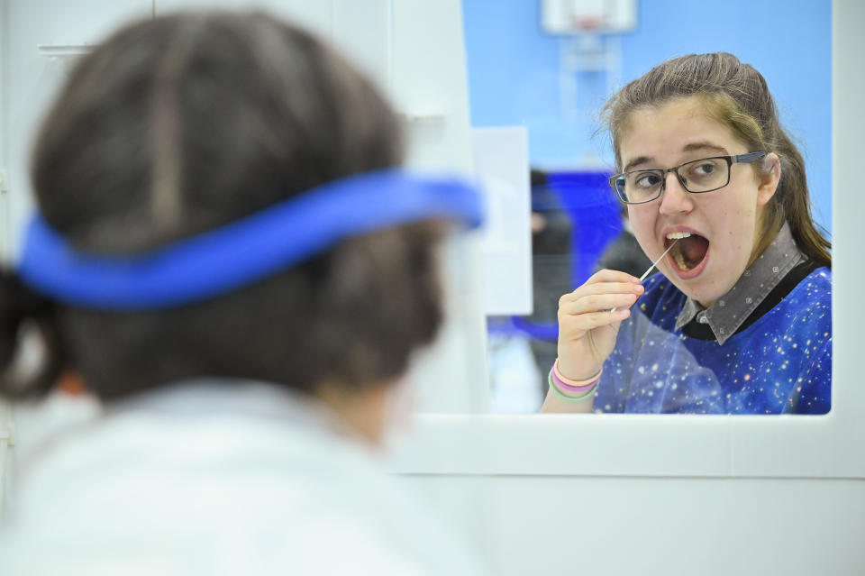 ST ANDREWS, SCOTLAND - NOVEMBER 27: A student at St Andrew University participates in testing of a lateral flow antigen test facility, before its opening at the weekend on November 27, 2020 in St Andrews, Scotland. St Andrews is one of several Scottish universities being supported by the Scottish Government to set up temporary testing centres to offer students Covid- 19 tests before they leave for home at the end of term. (Photo by Jeff J Mitchell/Getty Images)