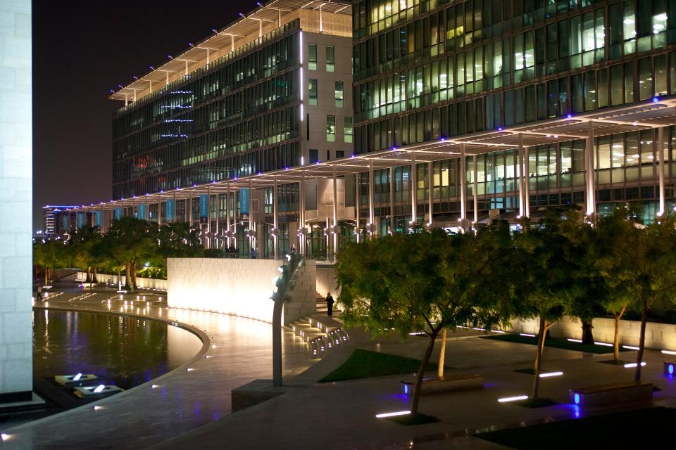 -Dubai International Financial Center (DIFC) at night in the central downtown business district.