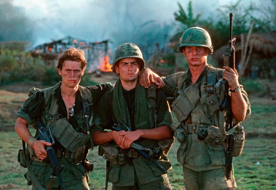 PHOTO: During the filming of Oliver Stone's 1986 film 'Platoon,' at a location near Manila, actors Willhem Dafoe, left, Charlie Sheen, center, and Tom Berenger pose for a photo.  (Roland Neveu/LightRocket via Getty Images, FILE)