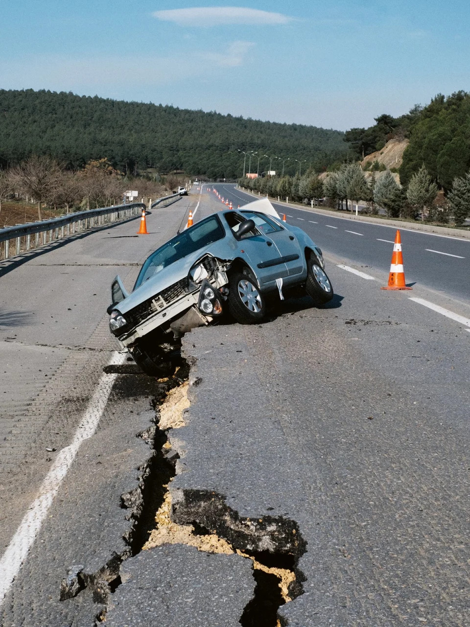 A car seen damaged on the broken highway road during the powerful earthquake on 8 February 2023 (Emin Ozmen/Magnum Photos)