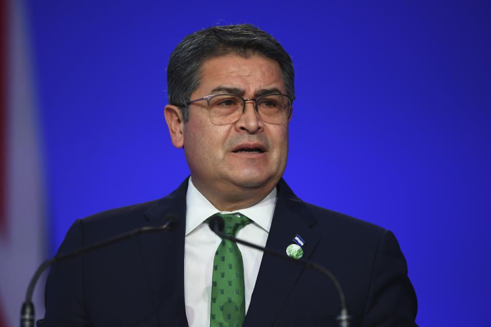 FILE - Honduras' President Juan Orlando Hernandez speaks during the opening ceremony of the UN Climate Change Conference COP26 in Glasgow, Scotland, Monday Nov. 1, 2021. Orlando Hernández has been convicted in New York, Friday, March 8, 2024, of charges that he conspired with drug traffickers, his military and police to enable tons of cocaine to make it unhindered into the United States. (Andy Buchanan/Pool via AP, File)