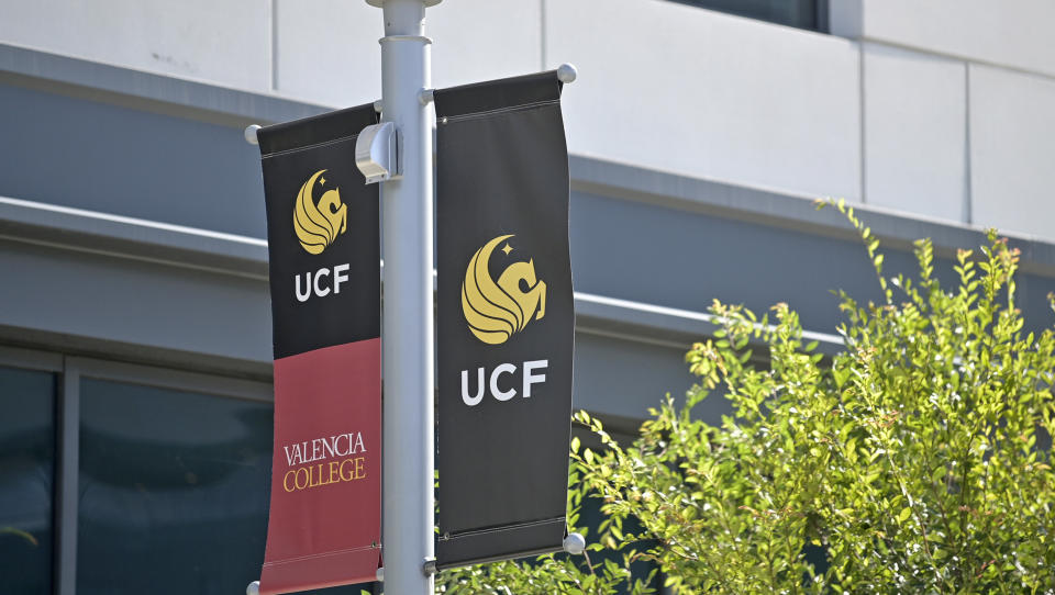 Banners for UCF and Valencia College (Phelan M. Ebenhack / AP)