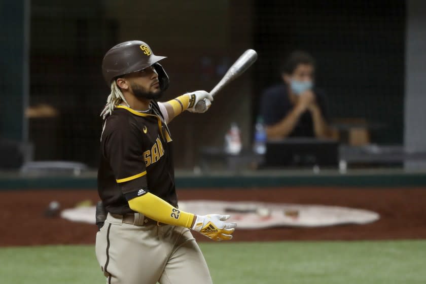 San Diego Padres' Fernando Tatis Jr. watches the flight of his grand slam.